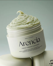 Jar of Arencia Fresh Green Cleanser with green cream on a light gray background