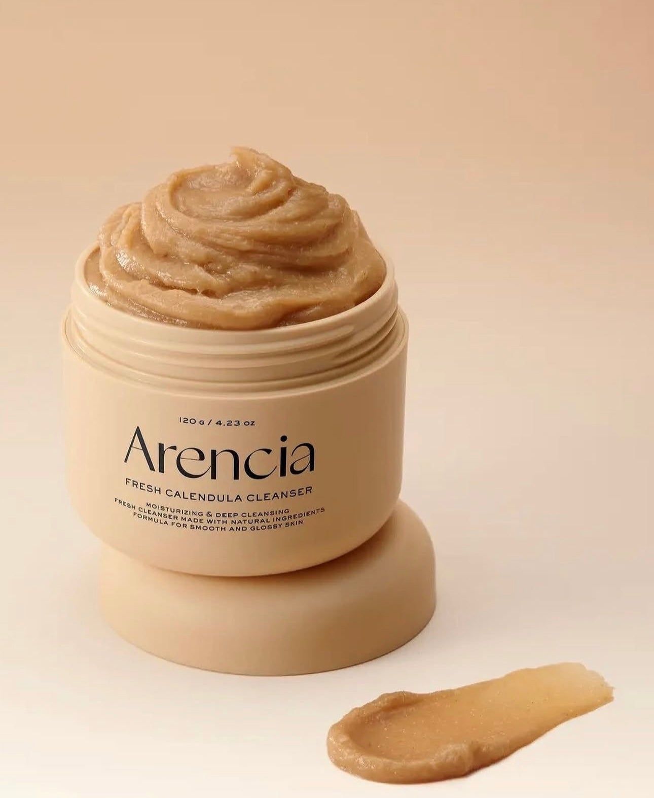 Arenicia Fresh Calendula Cleanser jar with cream on a beige background