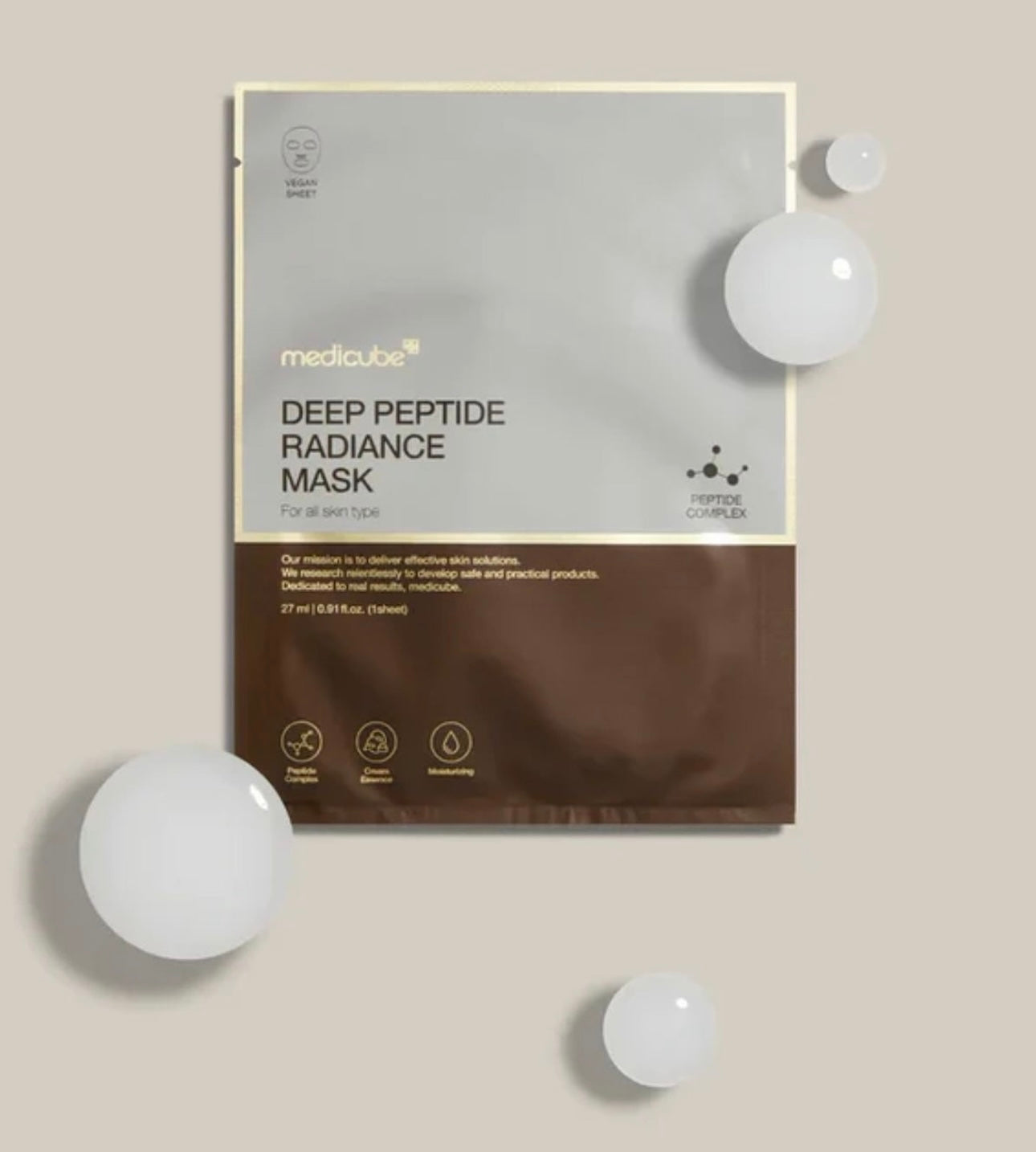 Medicube Deep Peptide Radiance Mask packaging on a beige background with white spheres.