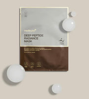 Medicube Deep Peptide Radiance Mask packaging on a beige background with white spheres.