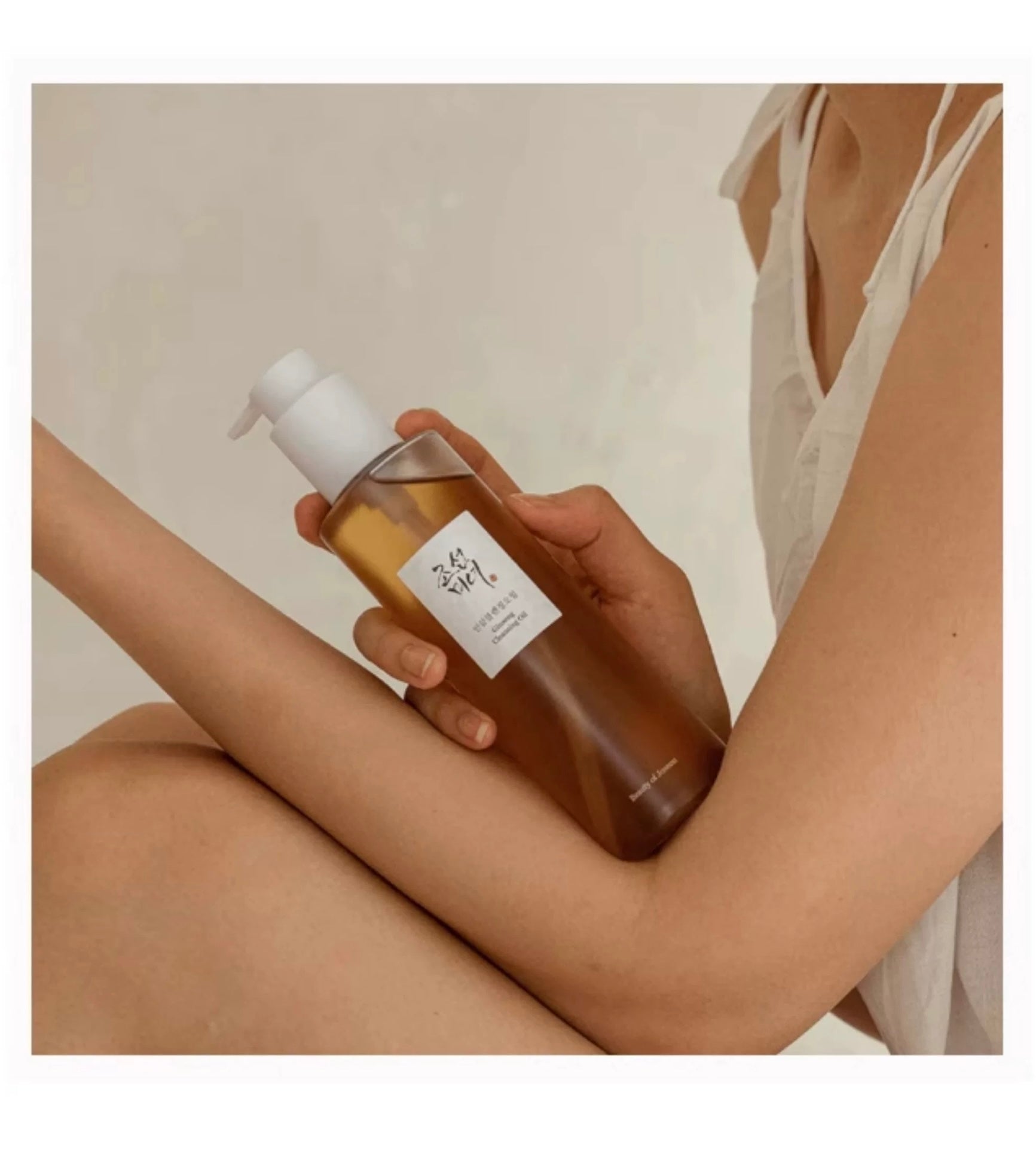 Person holdingBeauty of Joseon Ginseng Cleansing Oil 200ml with a neutral background