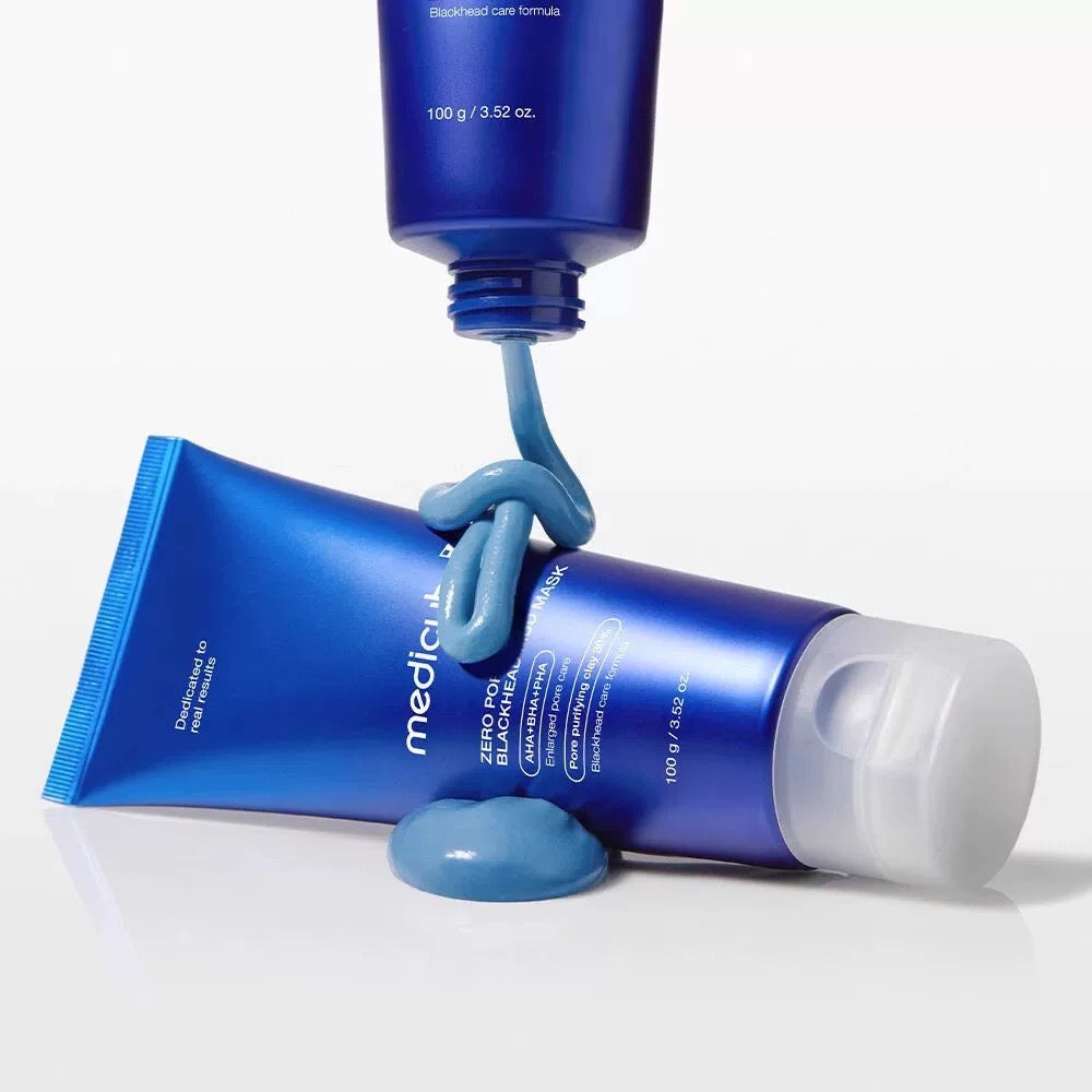Blue skincare product with tube and cream on a white background