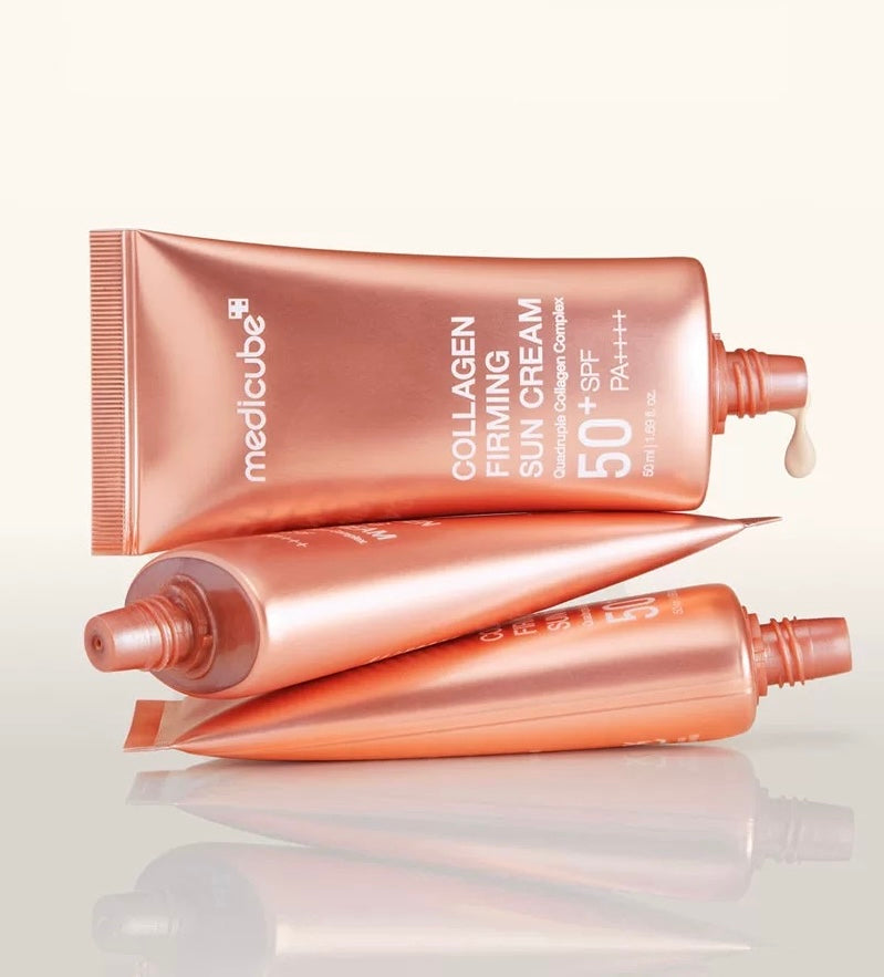 Two tubes of Medicube Collagen Firming Sun Cream on a white background